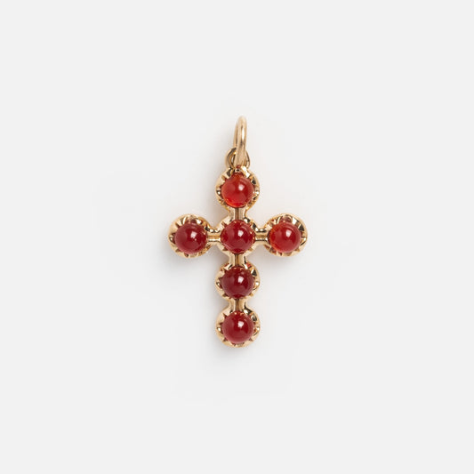 The 14k Vintage Revival Cross Charm features six round red onyx gemstones set in gold bezels, offering vintage appeal against a plain white background.