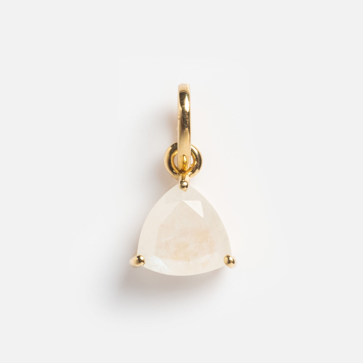 The Solid Gold Trillion Birthstone Charm showcases a triangular, faceted white gemstone in a three-prong setting, displayed against a plain white background.