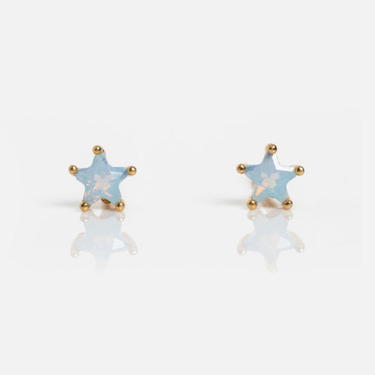 Milky Blue Star Studs: gold-trimmed, star-shaped earrings with a milky blue, slightly translucent center, shown on a white background.