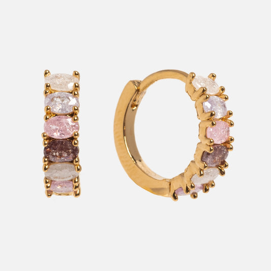 The Dreaming About You Hoops feature 18k gold plating and oval pastel gemstones in white, pink, and purple, shown against a plain white background.