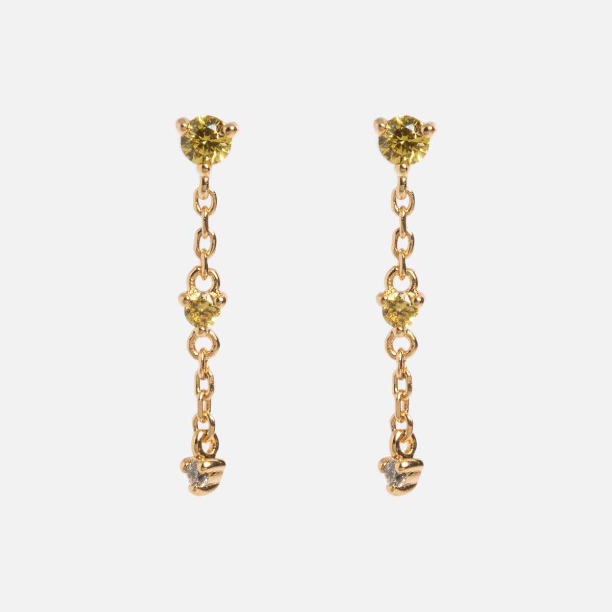The Celebration Ombre Birthstone Drop Studs are 14k gold plated earrings with yellow gemstones at the top and middle, linked by delicate gold chains and finished with a small gold accent, displayed on a white background.