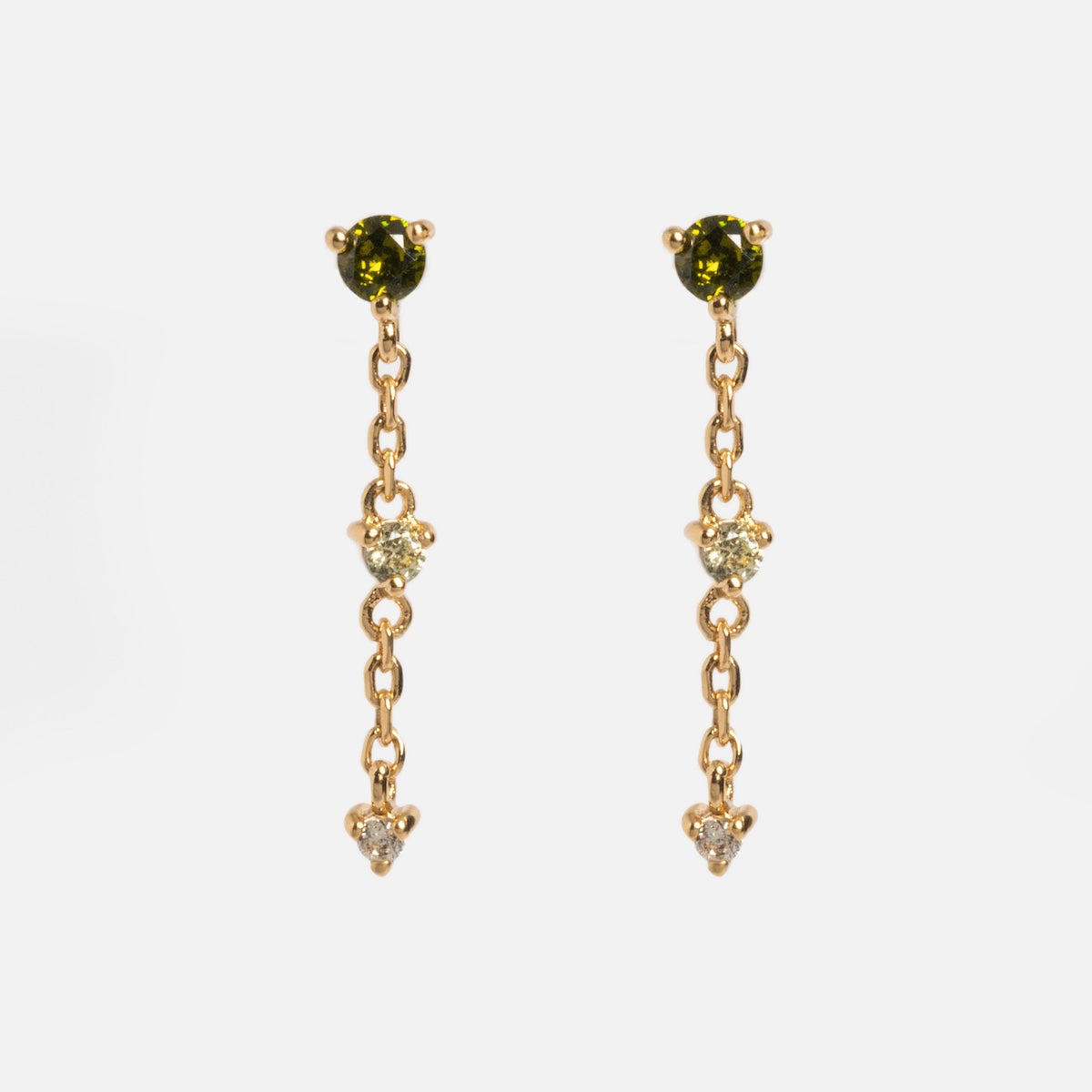 The Celebration Ombre Birthstone Drop Studs are 14k gold-plated earrings with green and white stones, perfect for adding a touch of elegance to any outfit.