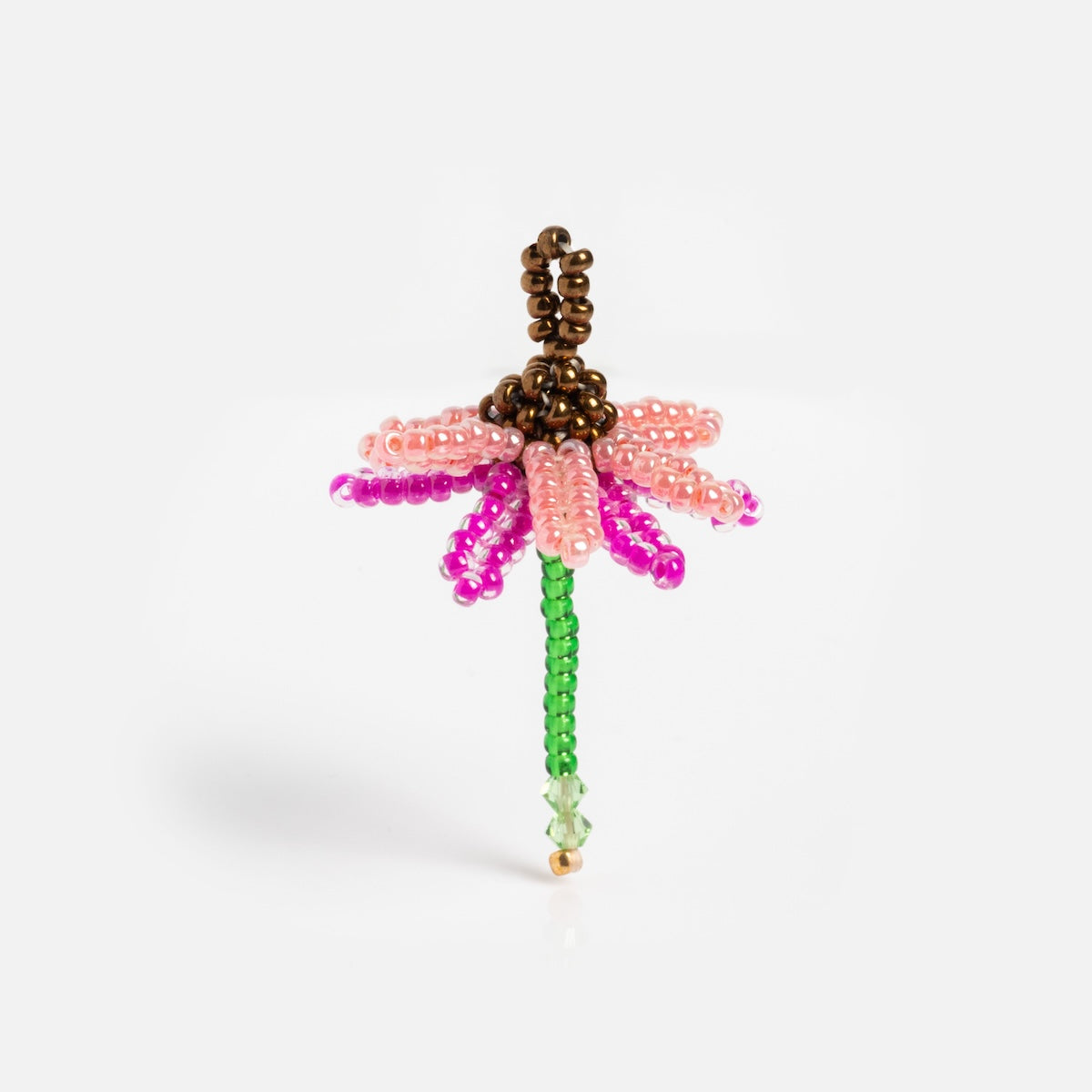 The Beaded Charm features a green stem, pink and light purple beaded petals, and a brown center—an adorable accent for any Tai Jewelry charm necklace, shown against a plain white background.