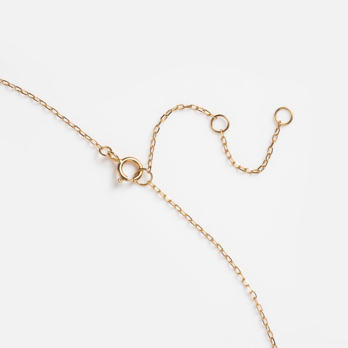 The Solid Gold 2025 June Capsule Vintage Inspired Alexandrite and Pearl Pendant Necklace features an adjustable chain with a spring ring clasp—ideal as a unique June birthstone or elegant vintage-inspired accessory. Displayed on a white background.