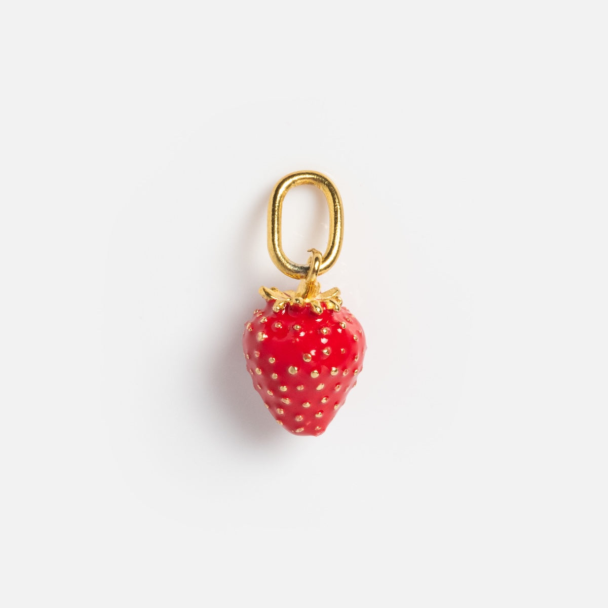 The Charms by Satomi Studio features a gold metal strawberry-shaped charm with red enamel, gold dots, and leaves, attached to a gold loop and shown on a white background.