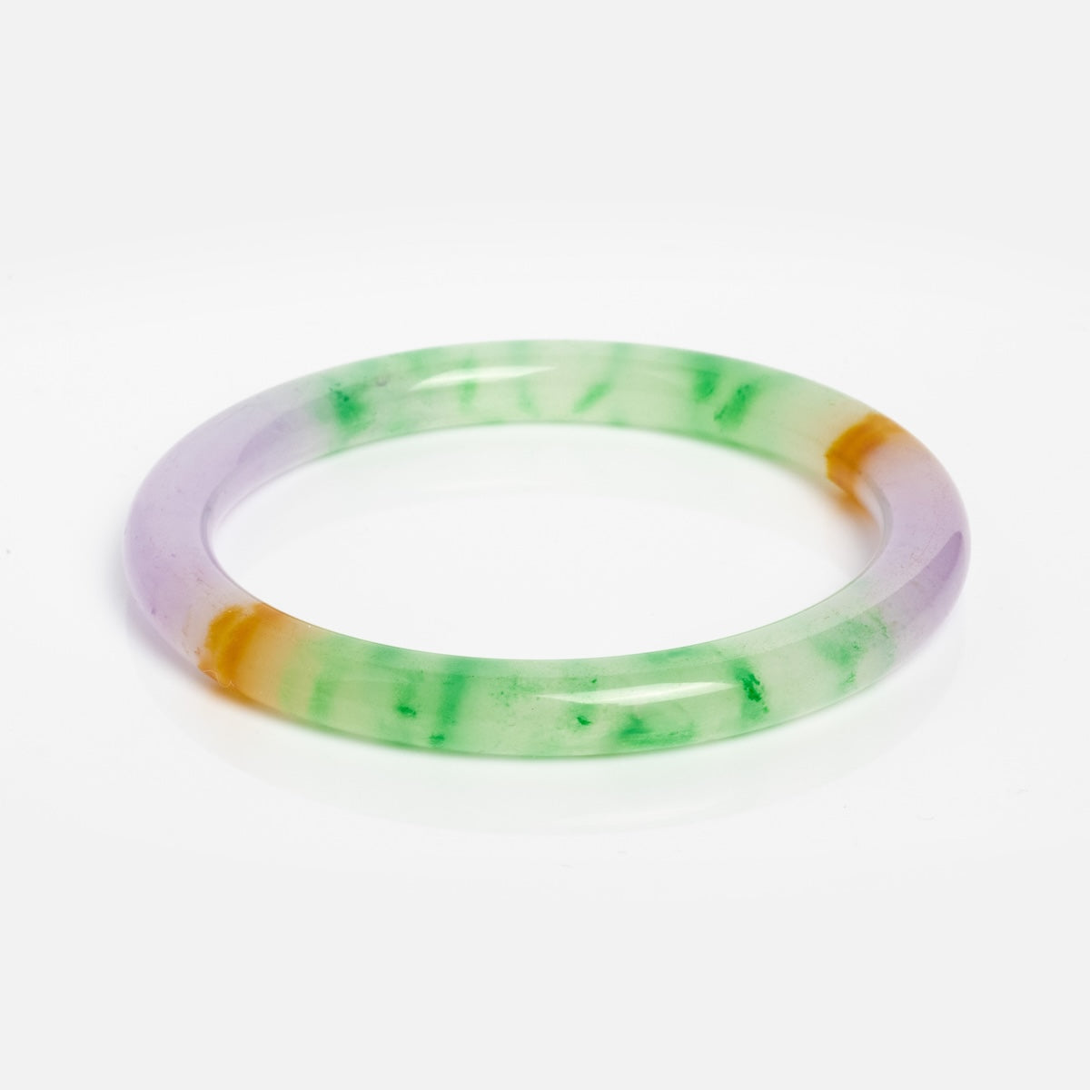 The Lavender Field Multicolor Quartzite Bangle features translucent green and amber streaks, set against a plain white background—a striking piece of wearable art.