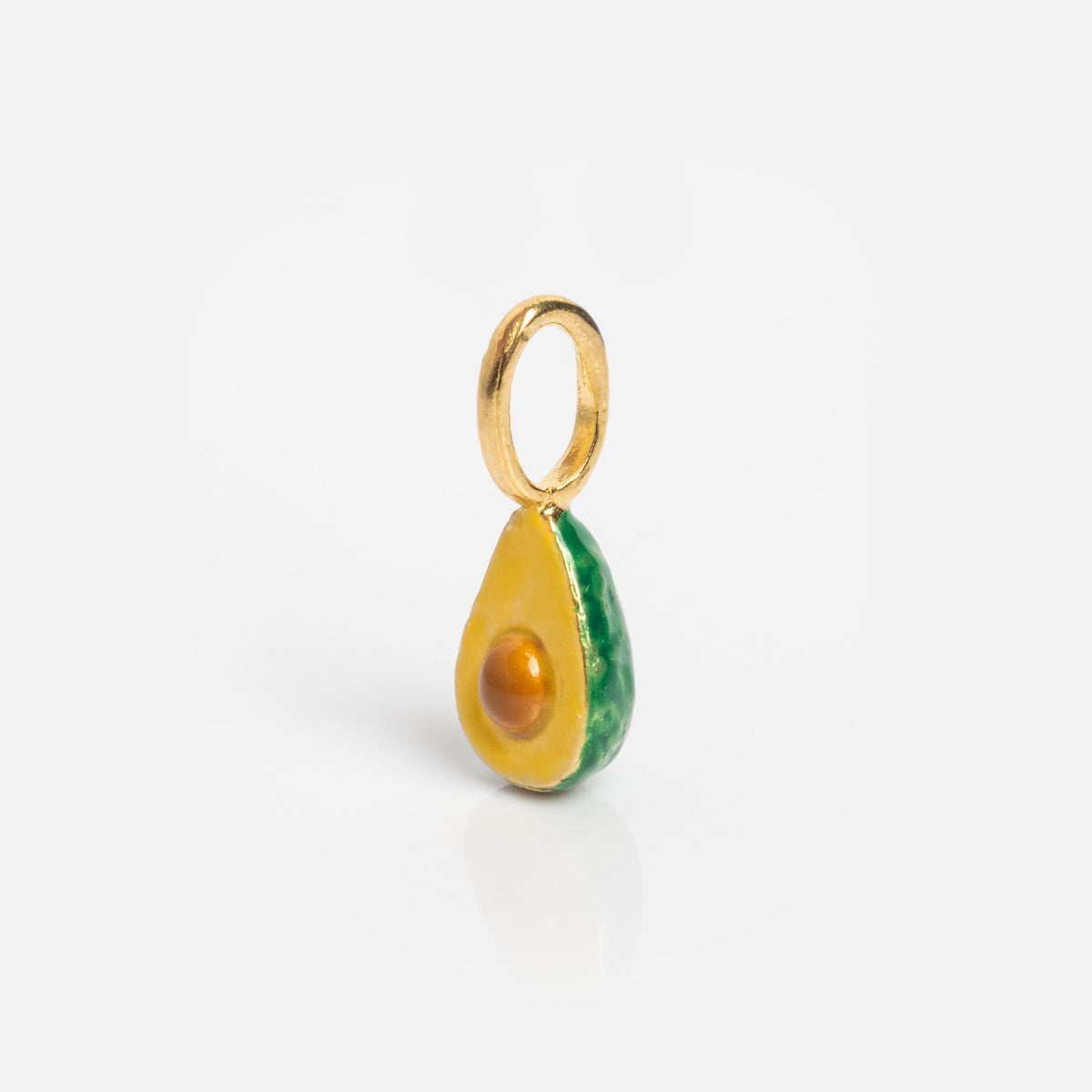 Charms by Satomi Studio: A small gold half avocado pendant with green enamel edge, yellow interior, raised gold pit, and gold loop—perfect as a necklace charm and easy to attach to your chain.