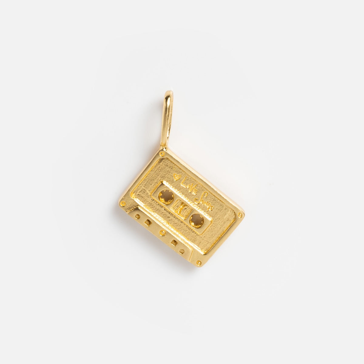 The Charms by Satomi Studio gold brass cassette tape charm features a small top loop for attaching to a chain, making it perfect for necklaces. Displayed against a plain white background.