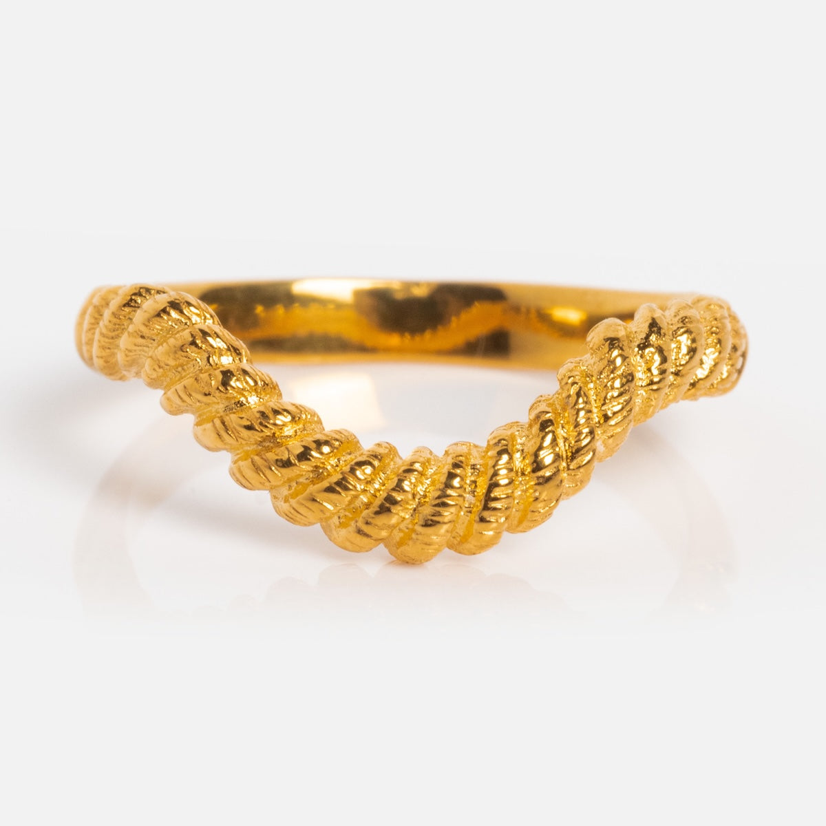 The Curved Rope Ring features a twisted, rope-like band in 18k gold vermeil, perfect for stacking and shown against a white background.