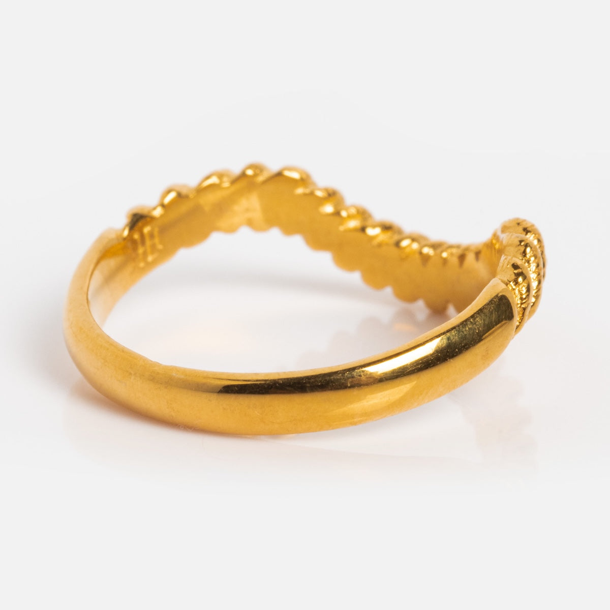 The Curved Rope Ring features a smooth band paired with a twisted rope design, crafted in 18k gold vermeil. Ideal for stacking, it’s showcased on a white background.