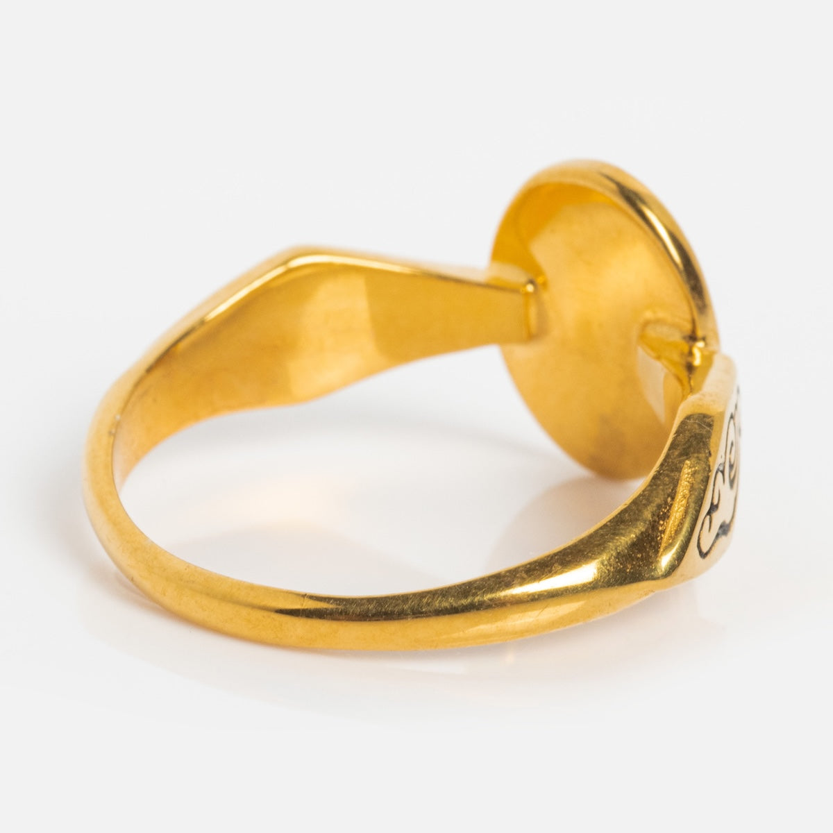 The Forget Me Not Ring features a polished yellow gold vermeil band with an oval setting. Shown from an angled side view, its shiny finish and elegant, minimalist design stand out against a white background.