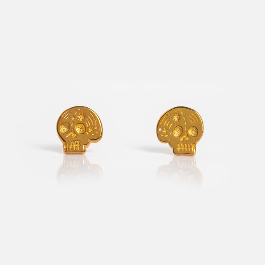 Skull Stud Earrings: 18k gold vermeil studs with engraved skull details, shown on a plain white background.