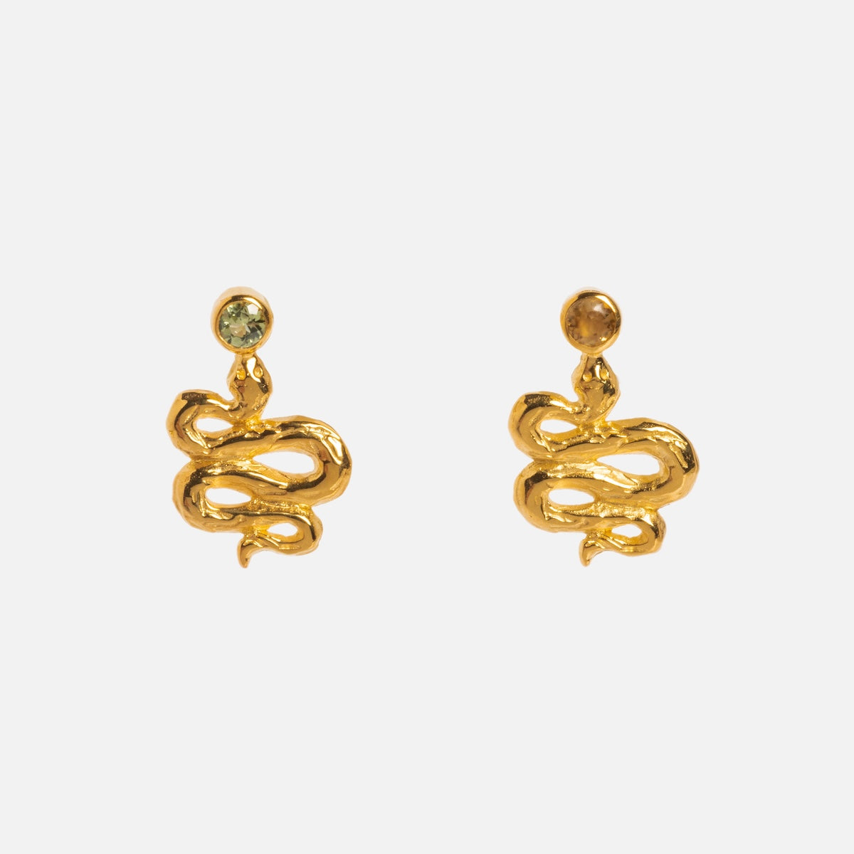 The Serpent Stud Earrings feature vibrant tourmaline gemstones and dangling gold snake designs, crafted in 18k yellow gold vermeil, shown against a plain white background.