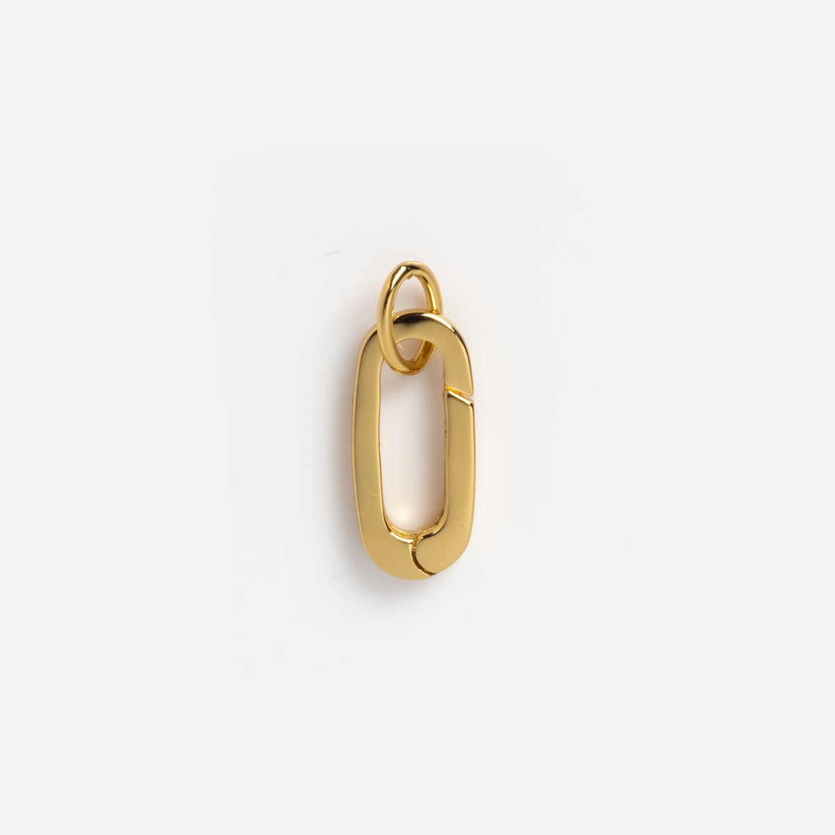 The Charm Clip: a 14k yellow gold pendant with two interlocking oval links—one slightly smaller—set against a white background. A chic accessory inspired by Local Eclectic’s signature style.