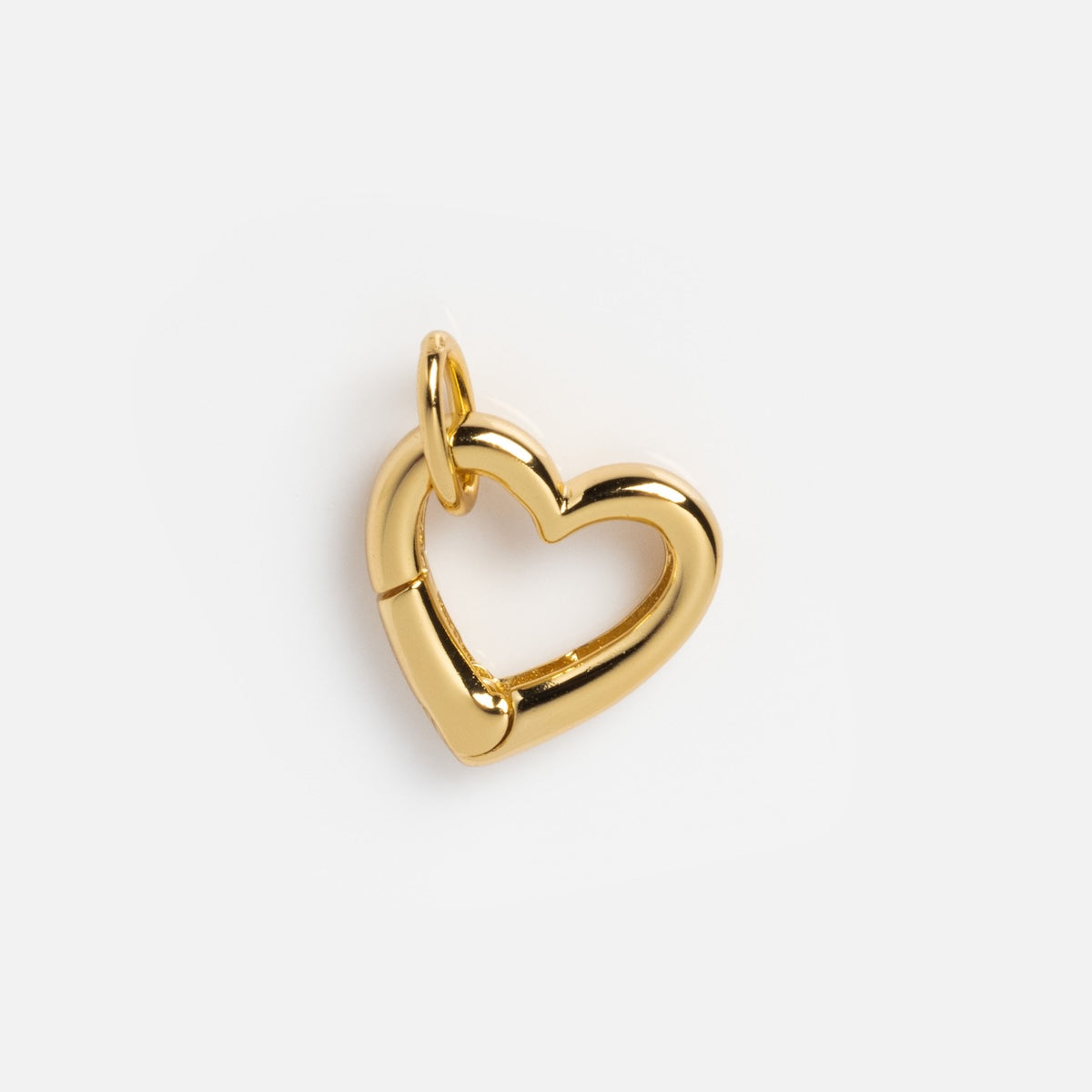 A shiny Charm Clip, crafted in 14k yellow gold with a heart shape and small top loop for necklace or charm attachment, displayed on a plain white background. Local Eclectic-inspired.