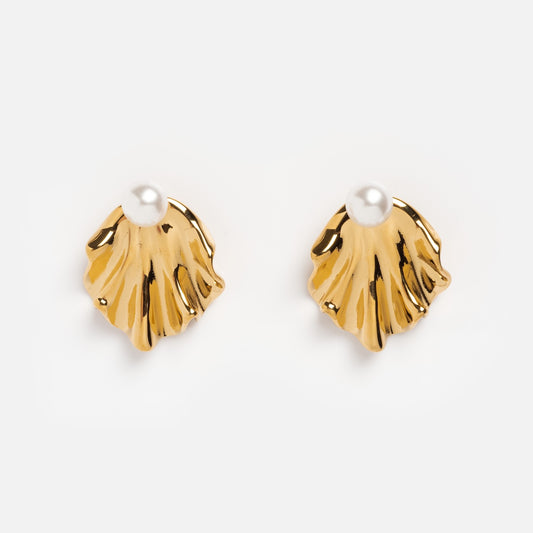 Waves Earrings: Gold shell-shaped earrings with a single round white pearl at the top, adding elegance to any look. Shown on a plain white background.