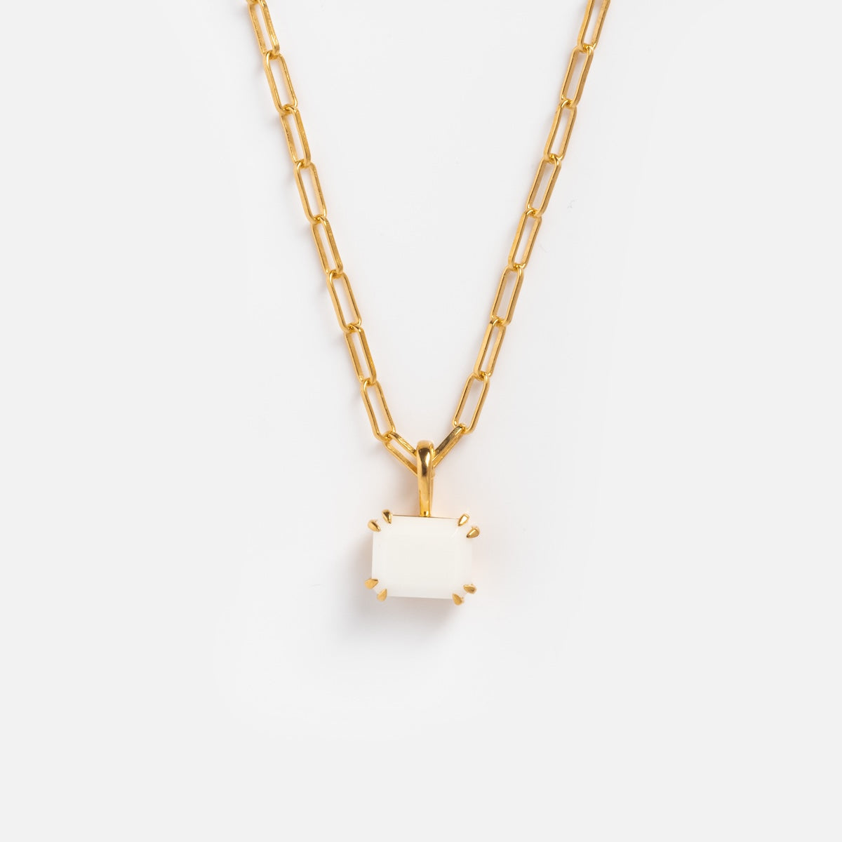The Plated Birthstone Necklace October Sample features a yellow gold plated rectangular link chain with a white glass opal gemstone pendant in a gold prong setting, shown against a plain white background.