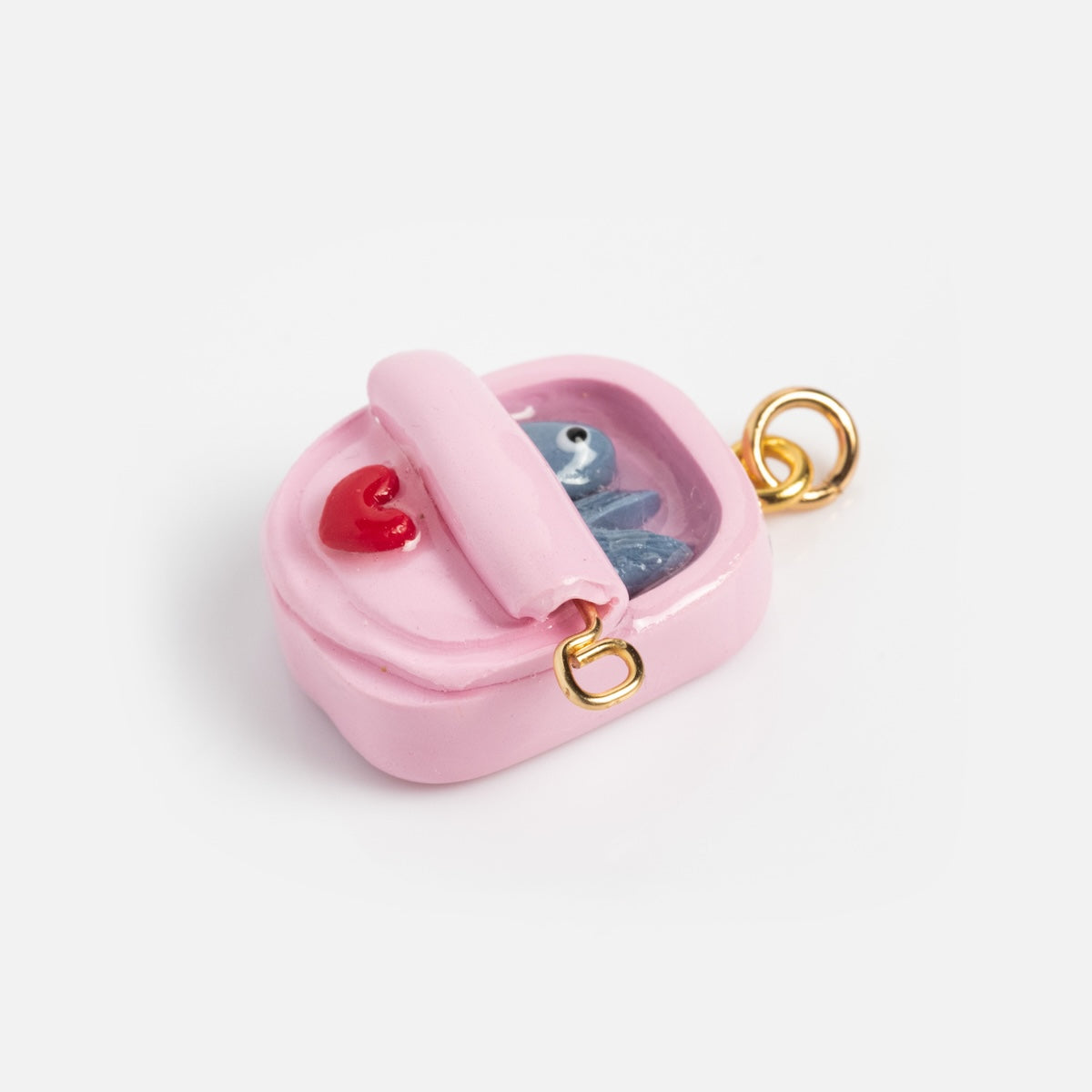 Charms by Warm Clay Co: A handmade, small pink rectangular charm with a gold loop, raised red heart, and blue animal inside a clear window on top—perfect as a unique necklace charm.