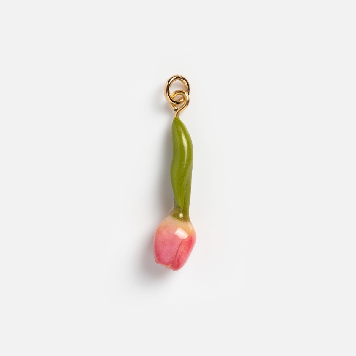 Charms by Warm Clay Co: A hand-crafted pink tulip bud charm with a green stem and small gold loop for attaching to jewelry, shown on a plain white background.
