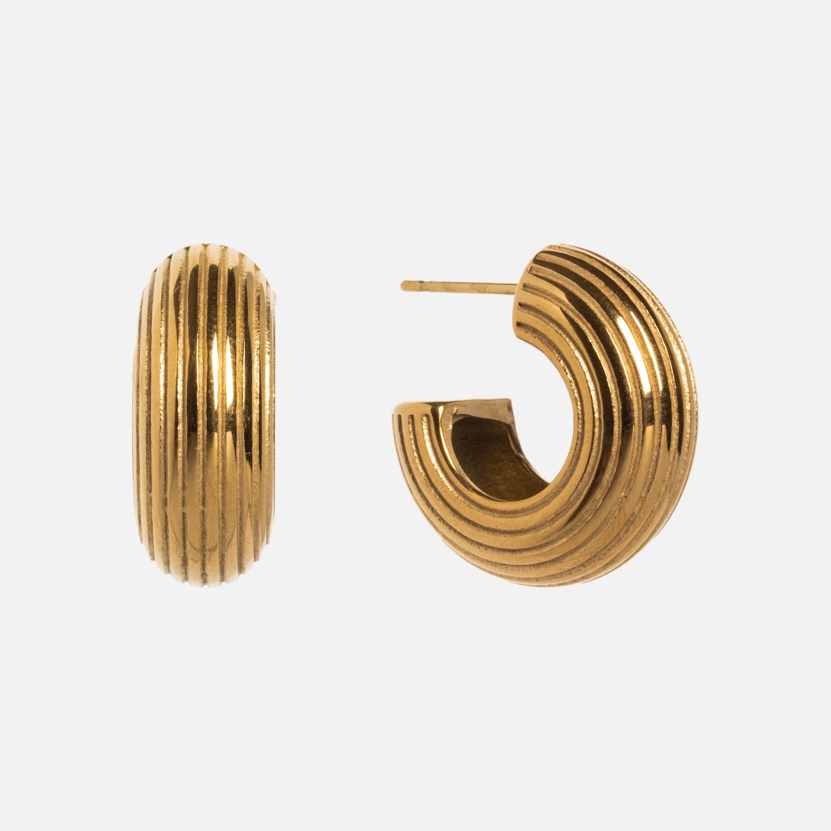 Jerry Earrings—gold hoop-shaped with a stylish textured design and ridged, grooved finish—are shown from the side and front against a plain white background.