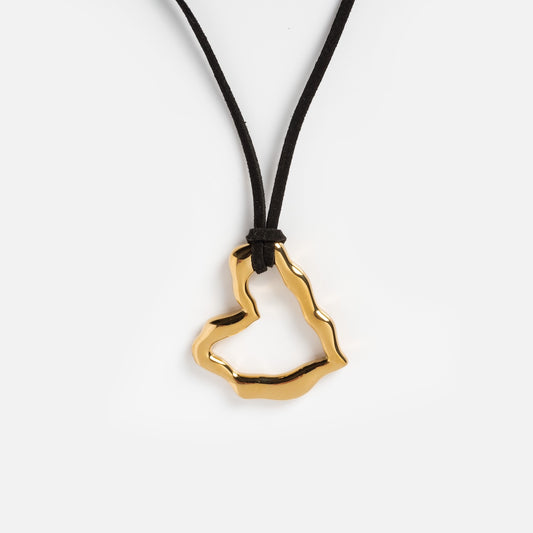 The Passion Necklace features a gold heart pendant on a vegan suede cord, offering boho chic style thats perfect for any occasion.