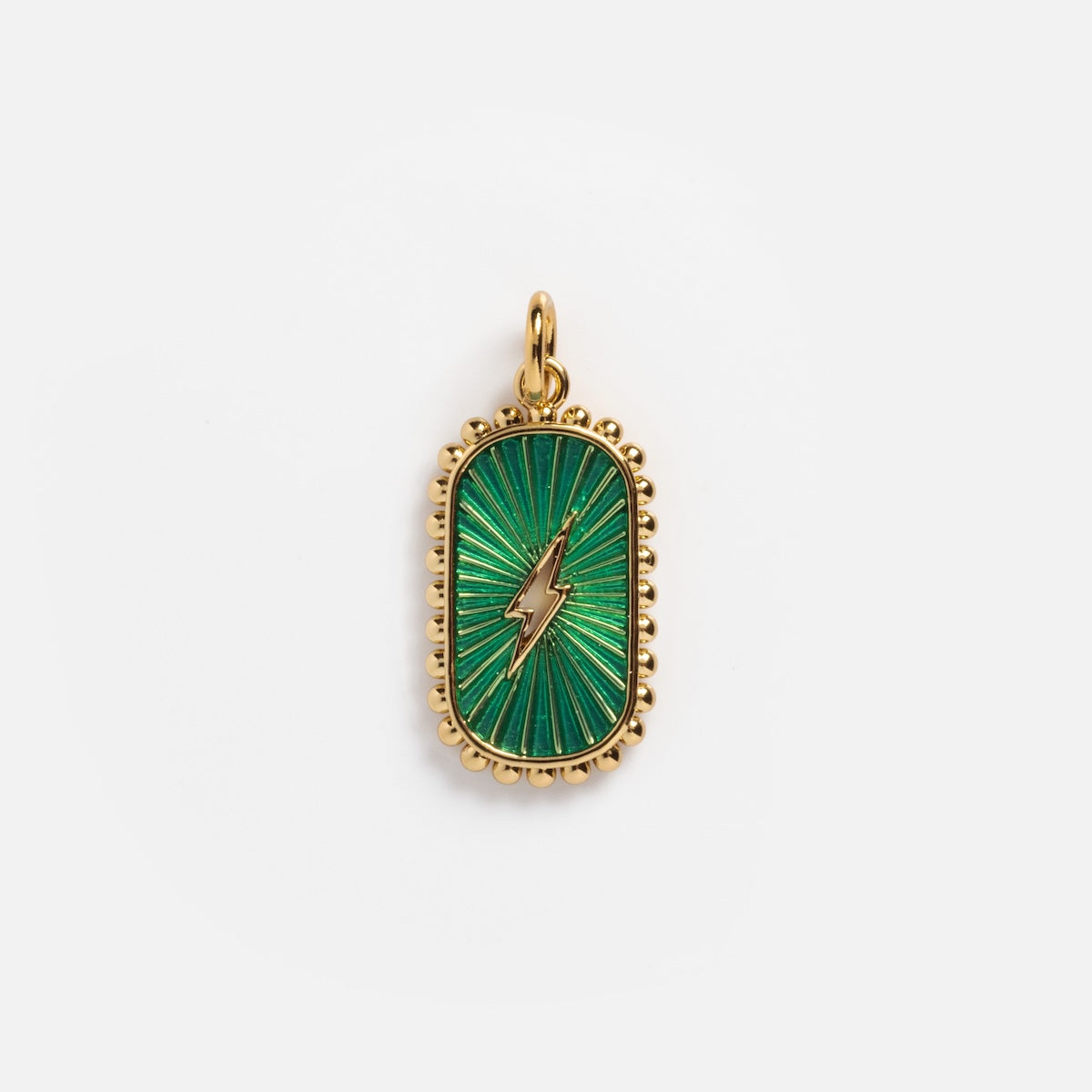 Charms by Elizabeth Stone: A 14k gold plated pendant with a green enamel background, radiating lines, central gold lightning bolt, and decorative gold edge evokes celestial allure against white.