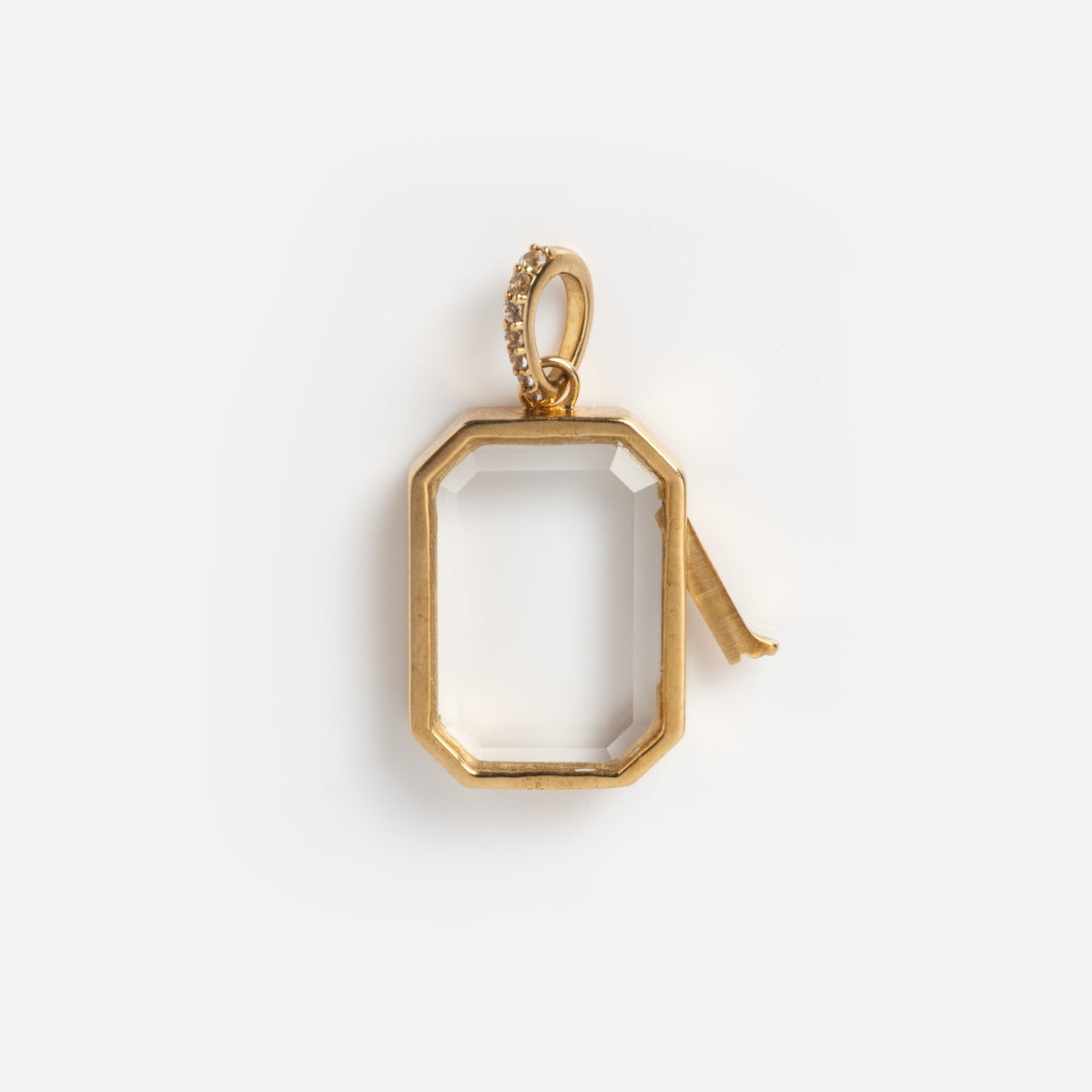 The Solid Gold Glass Charm Locket is an octagonal pendant with a clear center, hinged latch, and gemstone-accented loop, ideal for a personalized necklace and shown against a plain white background.