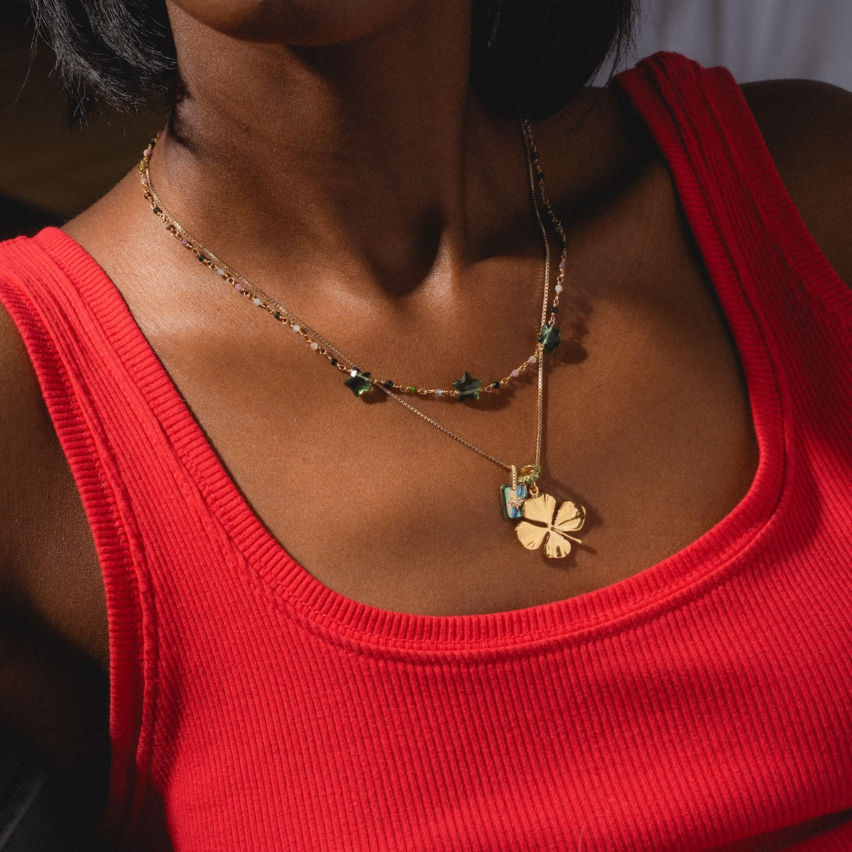 Collier Bangalore Necklace worn in a stack with a charm necklace