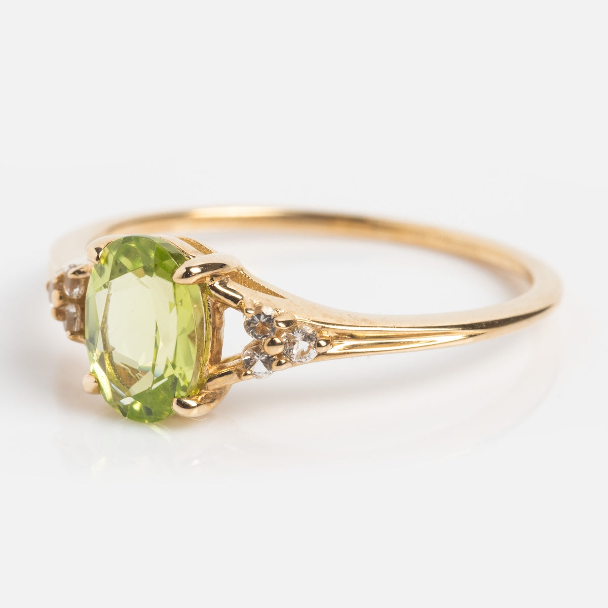 Side view of statement peridot ring