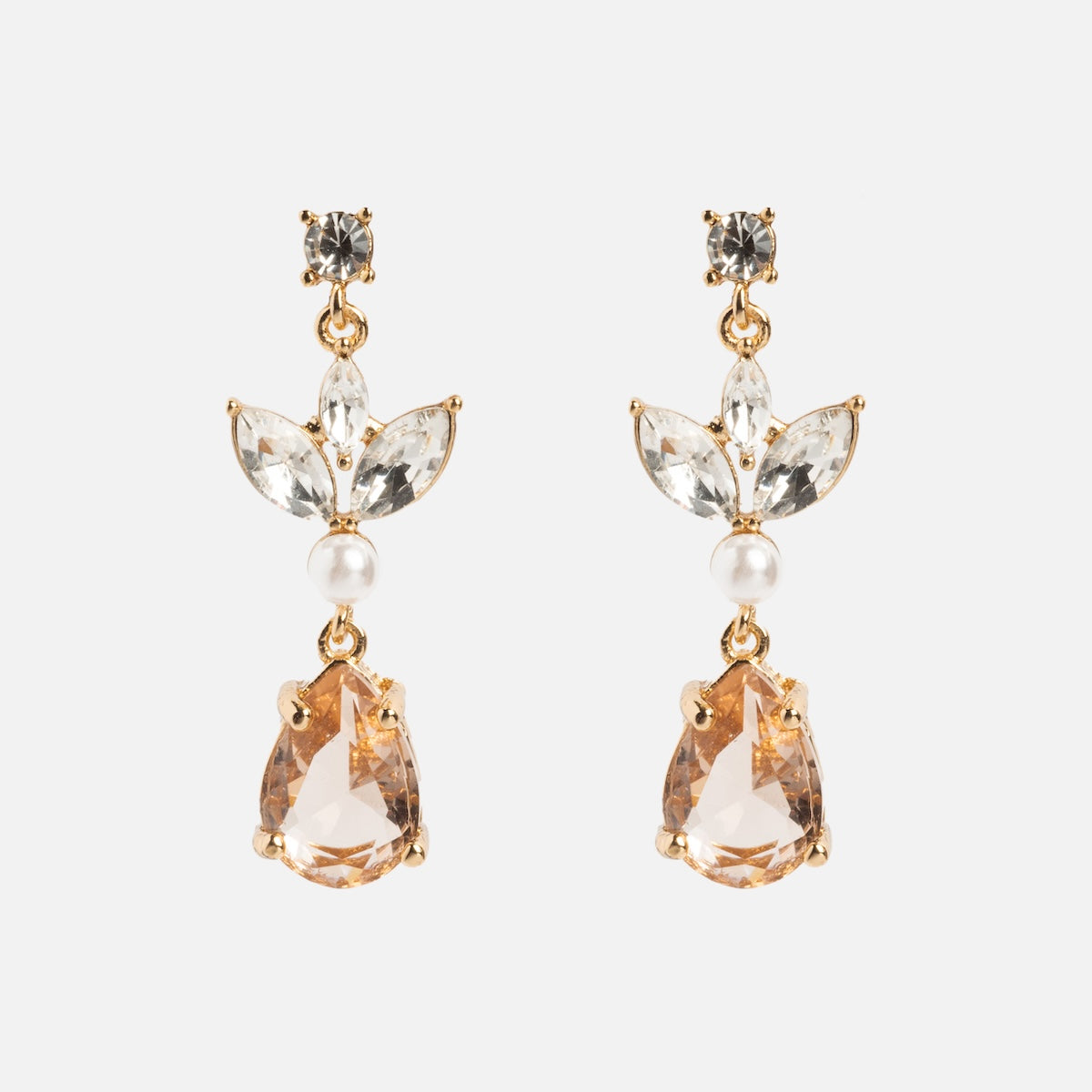 The Mini Rosalind Drop Earrings feature clear marquise and round gemstones, a small white pearl, and a large teardrop-shaped champagne gemstone on gold-plated settings, shown against a white background.