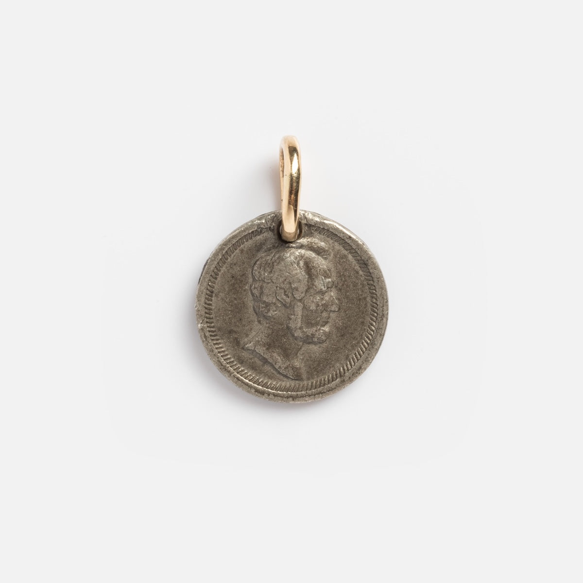 The Vintage 18k President Washington & Lincoln Coin Charm features engraved profiles and is attached to a gold loop, shown on a plain white background.