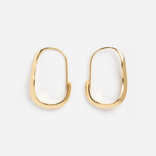The Mia Wave Hoops, crafted in 14k gold vermeil with a sleek oval silhouette, are modern gold hoop earrings shown on a plain white background.