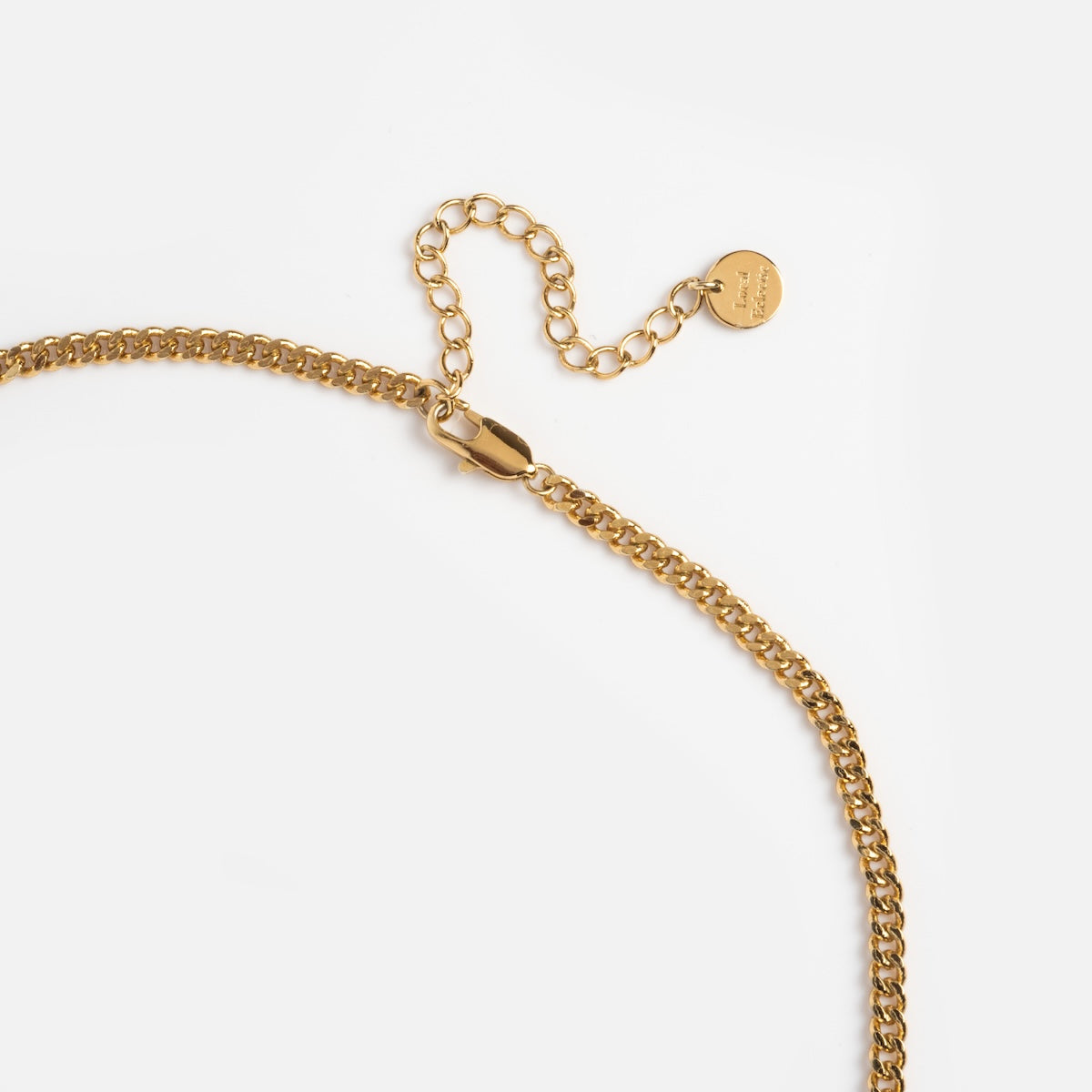 A close-up of the Hand Over Heart Charm Holder Necklace in 14k gold vermeil, featuring an adjustable extender and small round tag, shown on a plain white background.