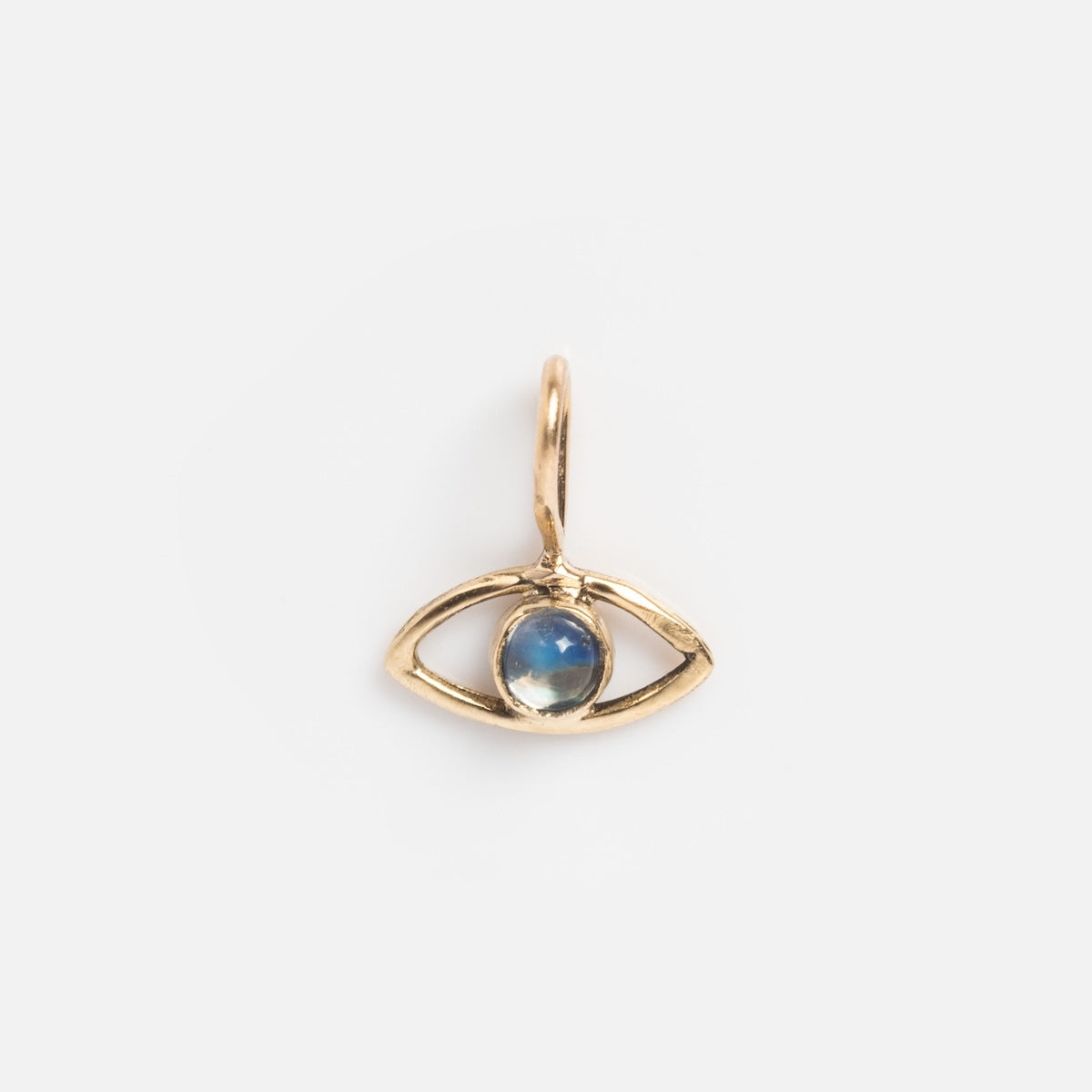 The 14k Solid Gold Tiny Charms by Acanthus features a gold eye-shaped pendant with a central blue gemstone, crafted from solid yellow gold and displayed on a plain white background.