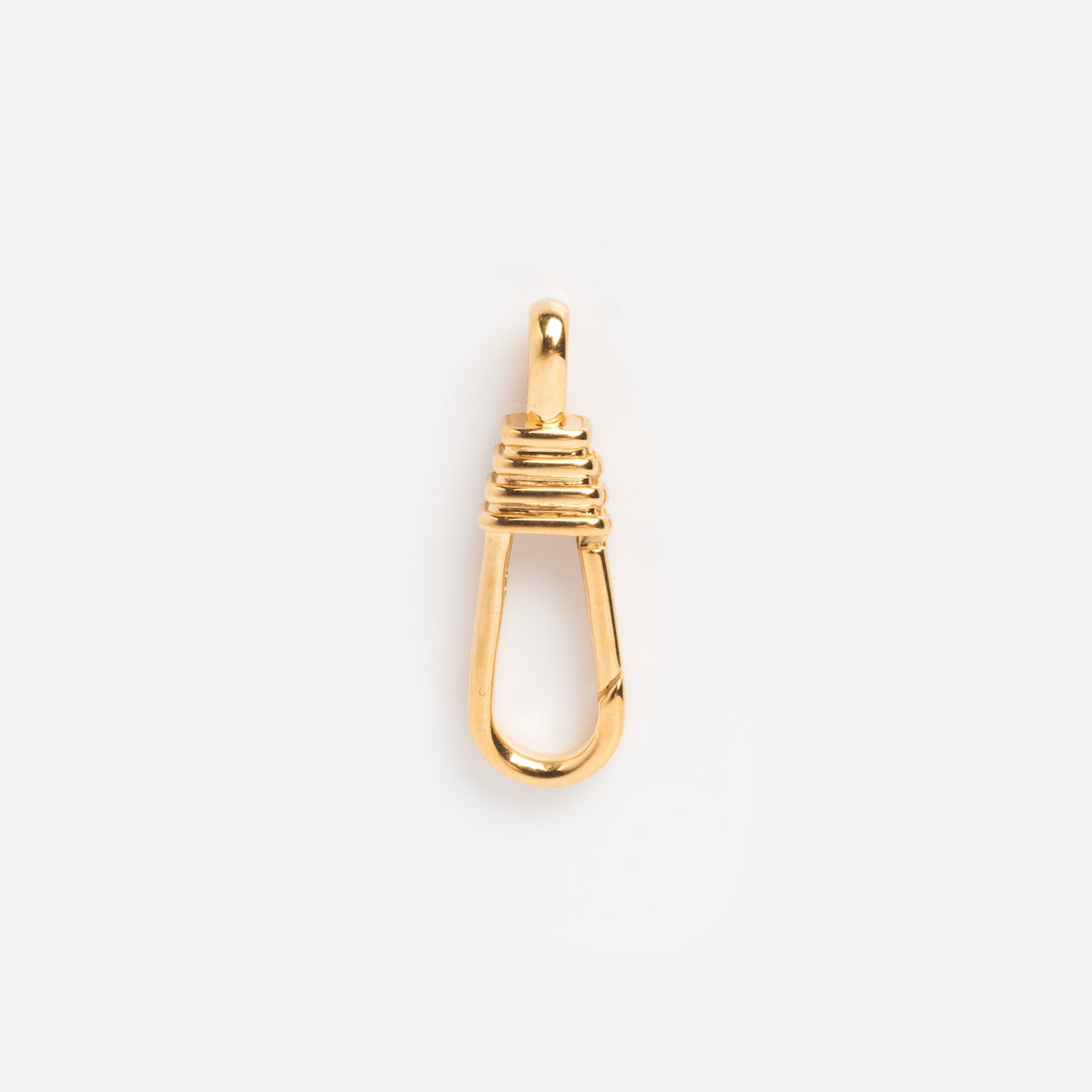 The Charm Clip is a single 14k gold vermeil safety pin-shaped pendant with a wrapped wire design near the top, shown on a plain white background. This Local Eclectic exclusive adds a unique touch to any jewelry collection.