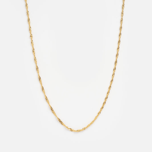 Gold chain necklace on a white background