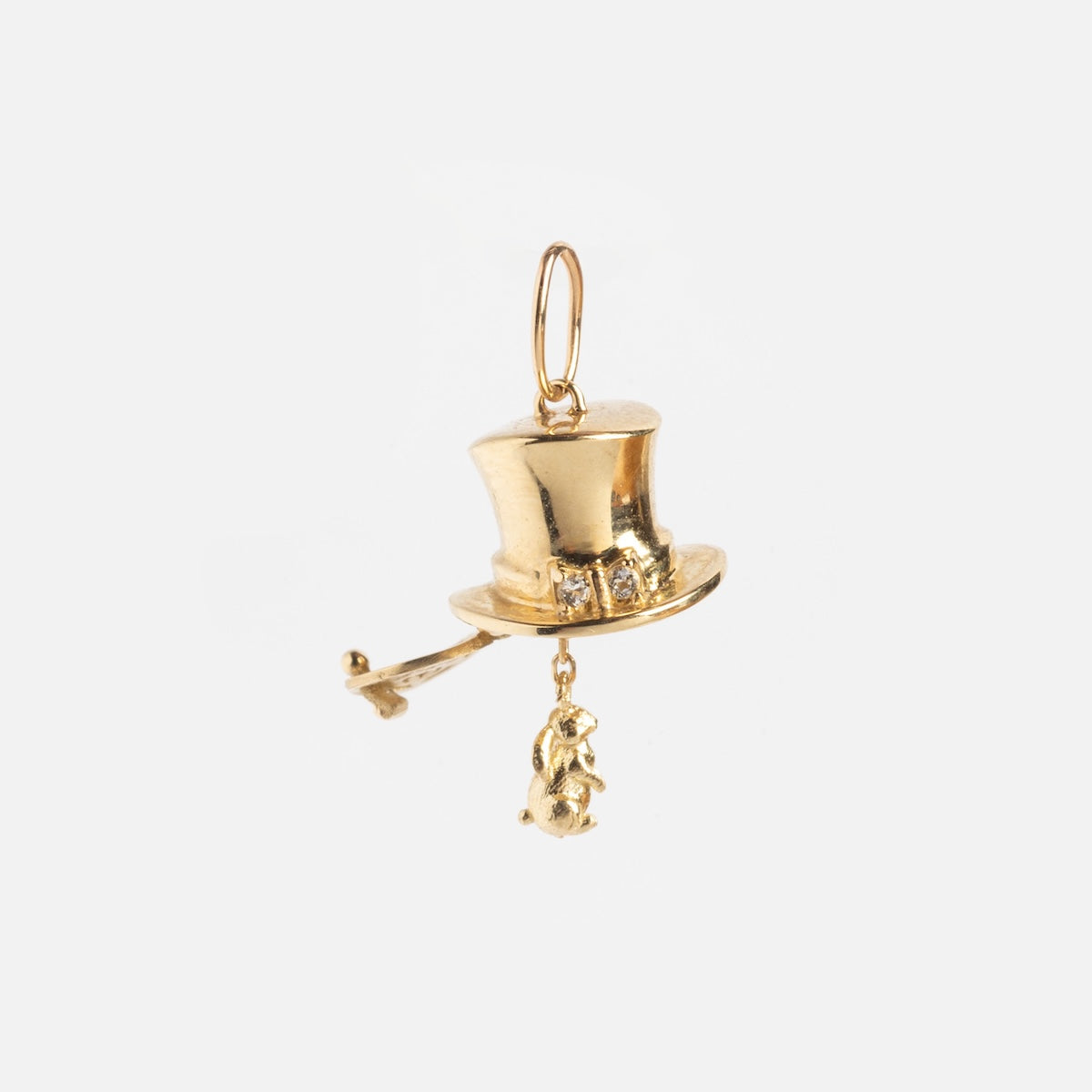 The Solid Gold Lucky Charm features a top hat shape with a small key and rabbit dangling from it, displayed on a plain white background.