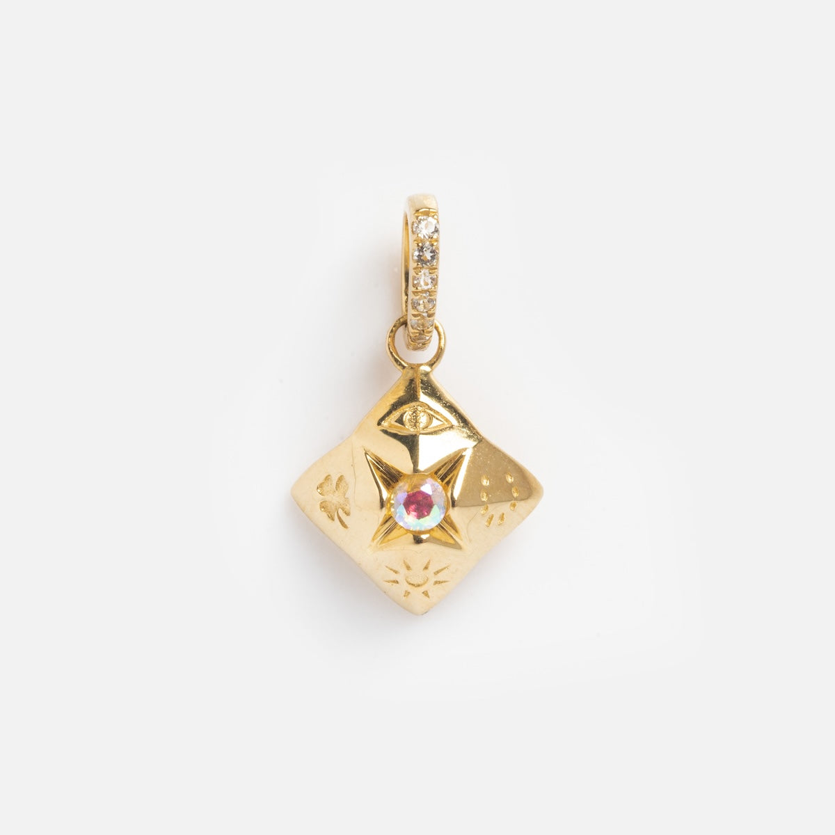The Solid Gold Lucky Charm features a pink gemstone center, star and eye engravings, and a bail embellished with clear stones, all set against a plain white background.