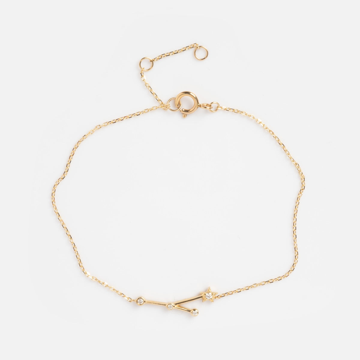 Solid Gold Zodiac Bracelet Cancer Sample: A delicate gold chain bracelet with a constellation-inspired design, small round gemstones, and an adjustable lobster clasp closure.