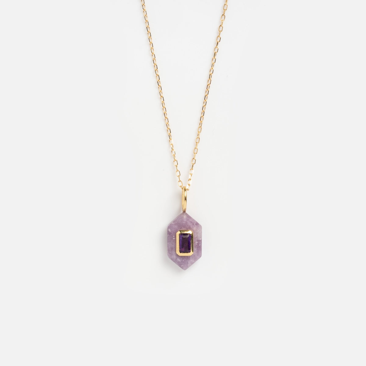 Solid Gold Large Aura Necklace Purple Sample featuring a geometric pendant with a rectangular gold frame and a dark purple stone at the center, shown on a plain white background.
