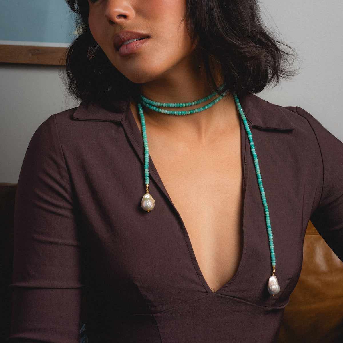 Woman wearing a beaded amazonite tie necklace with pearls