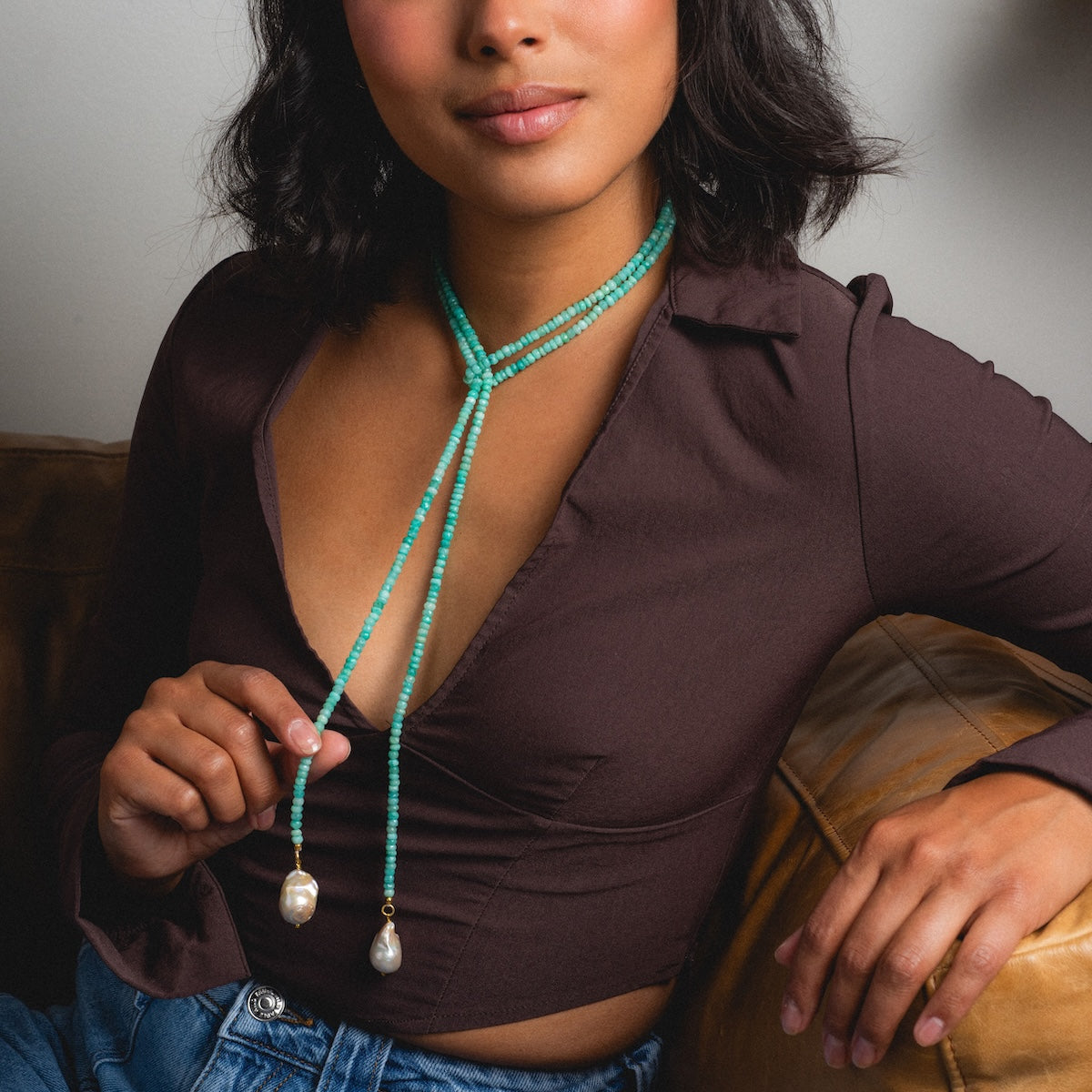 Woman wearing beaded amazonite tie necklace with pearls