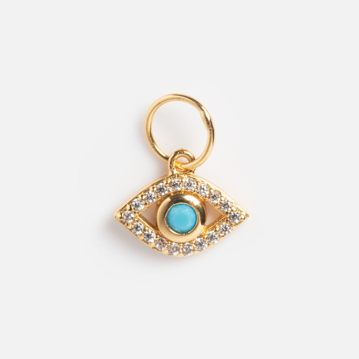 Charms by Jurate JLA: Eye-shaped gold-plated pendant with a turquoise center and a border of simulated diamonds, attached to a small yellow gold plated loop, shown on a plain white background.
