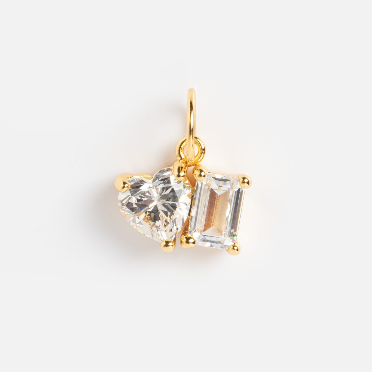 The Charms by Jurate JLA features yellow gold plating with two simulated diamonds—one heart and one rectangular—both in gold prongs on a small loop. Add this sparkling charm to your collection for a touch of elegance.
