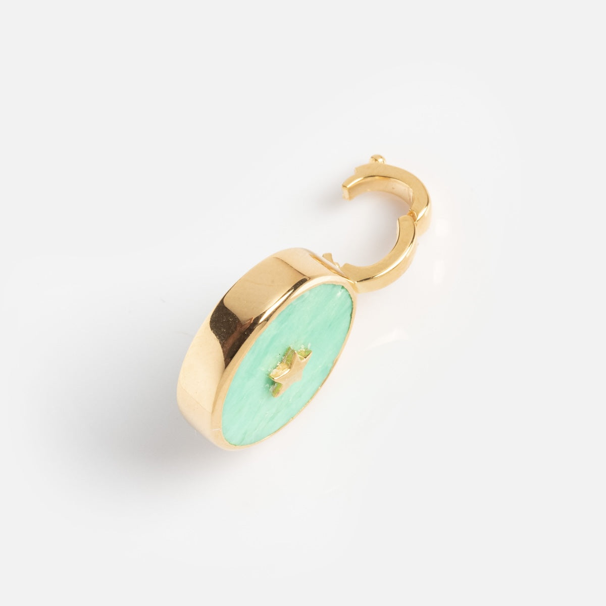 The Charms by Carrie Elizabeth Jewelry earring features a gold hoop with a round, mint-green enamel disc set in a gold frame, displayed on a plain white background.