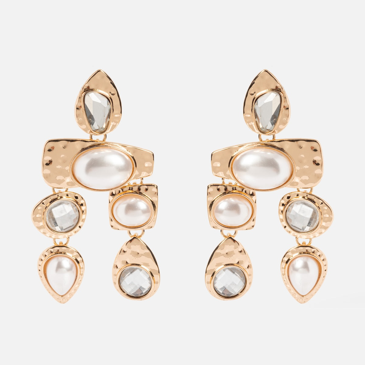 The Multi Stone Earrings feature hammered gold-tone metal, clear gemstones, and pearl-like accents in oval, square, and teardrop shapes for a standout look.