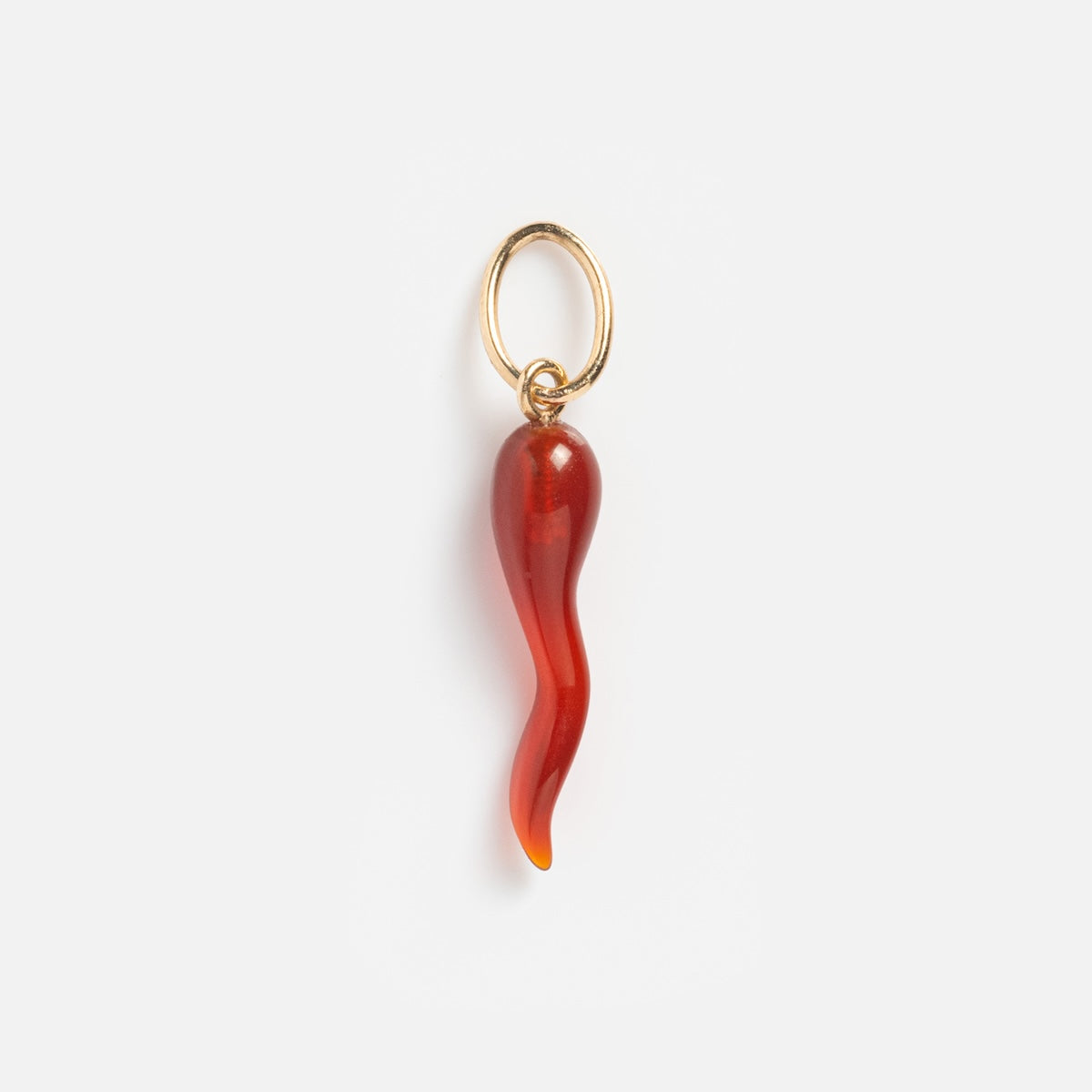 The Solid Gold Amulet Charm is a red, wavy, horn-shaped solid gold charm attached to a gold keyring, shown on a plain white background.