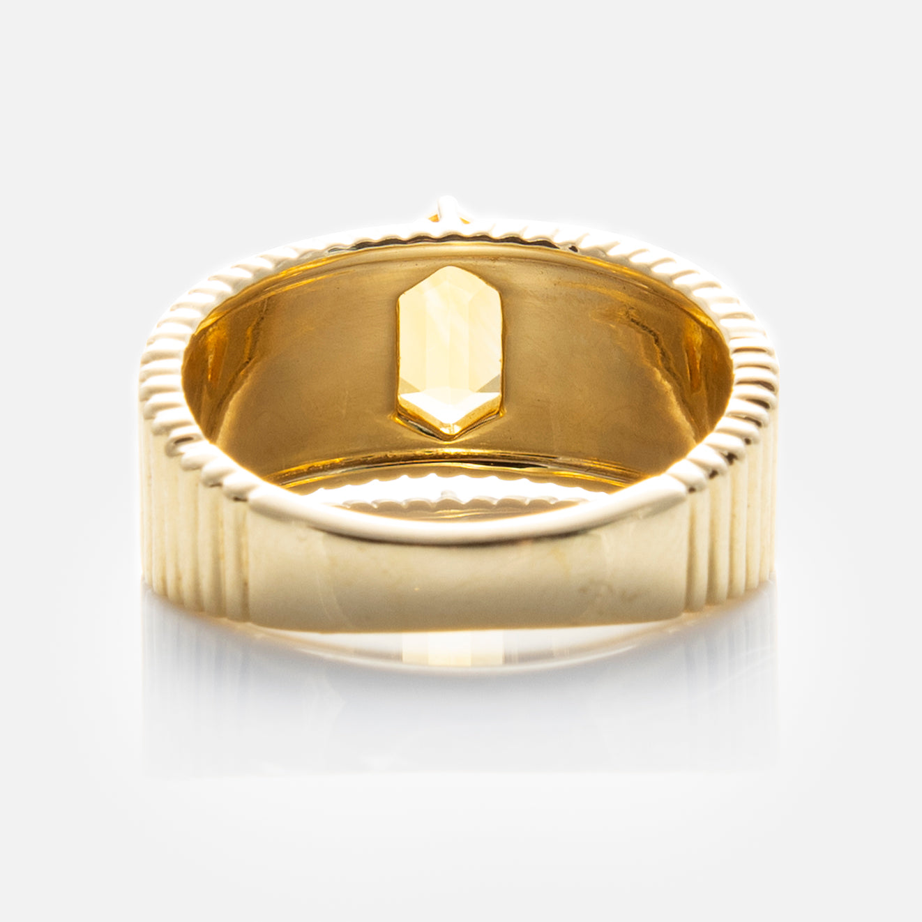 The Solid Gold Citrine Bold Fluted Cigar Band features 9k yellow gold with a ridged outer edge and a single faceted citrine set inside the band, shown against a white background.