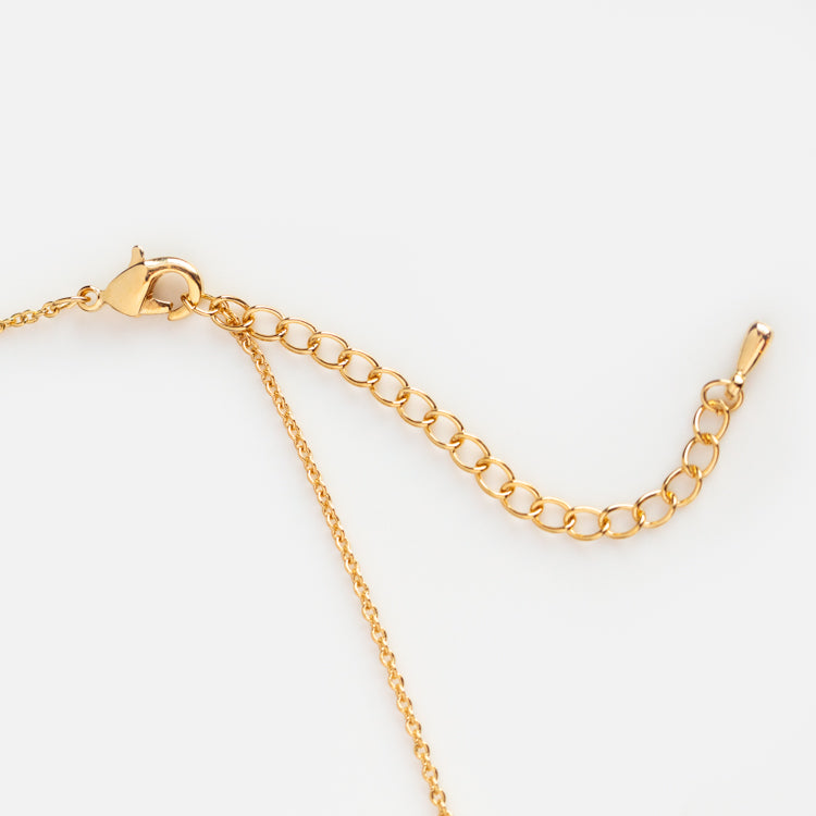 A close-up of the Scuba Diver Necklace, a yellow gold plated chain with an adjustable extender and lobster clasp, displayed on a white background.