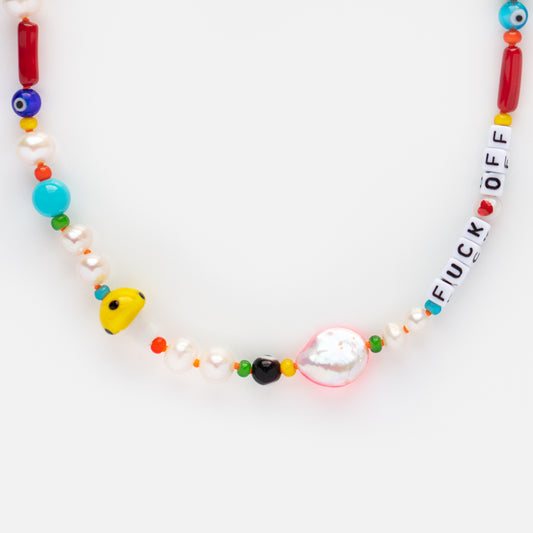The Handmade Beaded Eff Off Necklace features pearls, semi-precious stones, and white beads spelling “FUCK OFF” with a red heart, all displayed on a plain white background.